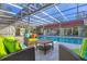 Inviting pool area with comfortable seating and a covered patio, perfect for outdoor relaxation and entertaining at 2605 Desoto Rd, Sarasota, FL 34234