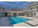 Enjoy the pool encased in a screened enclosure with cool deck, perfect for entertaining at 2605 Desoto Rd, Sarasota, FL 34234