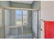 Close up of the stylish vintage bathroom shower with window at 2605 Desoto Rd, Sarasota, FL 34234