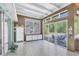 Spacious sunroom featuring large windows offering serene views of the outdoors at 2605 Desoto Rd, Sarasota, FL 34234