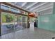 Sunroom with tiled floor and walls, floor to ceiling windows with a view of the pool at 2605 Desoto Rd, Sarasota, FL 34234