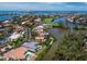 Aerial view of waterfront homes in a coastal neighborhood with a beautiful view of the bay at 3260 Bayou Rd, Longboat Key, FL 34228