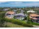 Waterfront home with backyard pool and screened in lanai in a tropical community at 3260 Bayou Rd, Longboat Key, FL 34228
