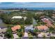 Aerial view of a home with a canal view near golf course and beaches at 3260 Bayou Rd, Longboat Key, FL 34228