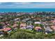 Aerial view of homes in a coastal neighborhood with pool and canal views near the beach at 3260 Bayou Rd, Longboat Key, FL 34228