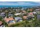 Coastal neighborhood with waterfront homes, tropical trees, and serene canal views at 3260 Bayou Rd, Longboat Key, FL 34228