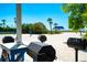 Outdoor grilling area with multiple grills, countertop space, and a view of the beach at 3260 Bayou Rd, Longboat Key, FL 34228