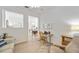 Home office with light beige sofa, wooden desk and chair, and ceiling fan at 4363 Kariba Lake Ter, Sarasota, FL 34243