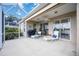 Relaxing screened patio with lounge chairs and grill at 4363 Kariba Lake Ter, Sarasota, FL 34243