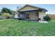 Screened patio and grassy backyard with wooden fence at 4532 N Shade Ave, Sarasota, FL 34234