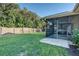 Large backyard with screened porch and wooden fence at 4532 N Shade Ave, Sarasota, FL 34234