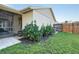 Side yard with lush greenery and a screened patio at 4532 N Shade Ave, Sarasota, FL 34234