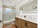 Modern bathroom with double vanity and a large walk-in shower at 4532 N Shade Ave, Sarasota, FL 34234