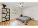 Cozy bedroom with hardwood floors and a large window at 4532 N Shade Ave, Sarasota, FL 34234