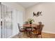 Cozy dining area with a round table and four chairs, next to sliding door at 4532 N Shade Ave, Sarasota, FL 34234