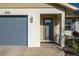 House exterior featuring gray door and garage at 4532 N Shade Ave, Sarasota, FL 34234