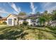 Charming single-story home with landscaped lawn and gray garage door at 4532 N Shade Ave, Sarasota, FL 34234
