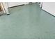 Light teal garage floor with flecks of darker color at 4532 N Shade Ave, Sarasota, FL 34234