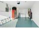 Garage interior with washer, dryer, and storage; light teal floor at 4532 N Shade Ave, Sarasota, FL 34234