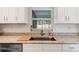 Kitchen sink and granite countertop with a window overlooking the backyard at 4532 N Shade Ave, Sarasota, FL 34234