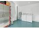 Garage laundry area with washer, dryer, and ample storage at 4532 N Shade Ave, Sarasota, FL 34234
