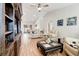 Bright living room with hardwood floors, comfy seating, and built-in shelving at 4532 N Shade Ave, Sarasota, FL 34234