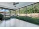 Spacious screened porch with ceiling fan, overlooking backyard at 4532 N Shade Ave, Sarasota, FL 34234