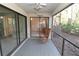 Relaxing screened porch with rocking chair and view of nature at 4713 Winslow Beacon # 5, Sarasota, FL 34235