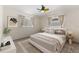 Cozy bedroom featuring neutral tones, two windows and modern decor at 5164 Windward Ave, Sarasota, FL 34242
