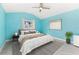 Tranquil blue bedroom featuring unique walls and decor, offering a relaxing retreat at 5164 Windward Ave, Sarasota, FL 34242
