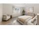 Comfortable bedroom featuring wood floors, a cozy chair, and neutral decor at 5164 Windward Ave, Sarasota, FL 34242