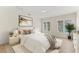 Bright and airy bedroom featuring wood floors and natural light at 5164 Windward Ave, Sarasota, FL 34242