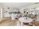 Open concept kitchen with stainless steel appliances and a breakfast bar, seamlessly connected to dining area at 5164 Windward Ave, Sarasota, FL 34242