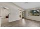 Bright bedroom with wood flooring and sliding glass doors at 5436 Hampstead Heath # 25, Sarasota, FL 34235