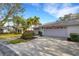 Charming single-story home with a well-manicured lawn and a two-car garage at 5436 Hampstead Heath # 25, Sarasota, FL 34235