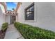 Inviting walkway leading to the front entrance with a well-manicured hedge at 5436 Hampstead Heath # 25, Sarasota, FL 34235