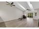 Spacious living room with vaulted ceilings, skylights, and wood floors at 5436 Hampstead Heath # 25, Sarasota, FL 34235