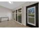 View of sunroom with sliding glass doors and tiled flooring at 5436 Hampstead Heath # 25, Sarasota, FL 34235