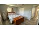 Relaxing bedroom with a double bed and built-in closet at 5938 S Lockwood Ridge Rd, Sarasota, FL 34231