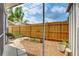 Small backyard with wooden fence, garden, and patio at 604 49Th Avenue W Dr, Bradenton, FL 34207