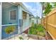 View of backyard with fencing and side entrance, providing easy access and privacy at 604 49Th Avenue W Dr, Bradenton, FL 34207