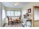 Cozy dining area with a table for two, bright windows, and a warm, inviting atmosphere at 604 49Th Avenue W Dr, Bradenton, FL 34207