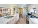 Bright kitchen featuring stainless steel appliances, wood cabinets, and modern countertops at 604 49Th Avenue W Dr, Bradenton, FL 34207