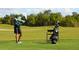 Golfer on the course taking a swing near golf bag at 7131 Sandhills Pl, Lakewood Ranch, FL 34202