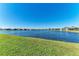 Serene backyard view of a pond and neighborhood homes at 9272 Ballaster Pointe Loop, Parrish, FL 34219