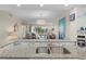 Kitchen boasts granite countertops and view of living room at 931 Wexford Blvd # 931, Venice, FL 34293