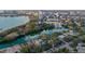 Breathtaking aerial view of a waterfront property near the city, nestled among lush trees and a tranquil waterway at 1541 Bay Point Dr, Sarasota, FL 34236