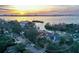 An aerial view showcases the expansive coastal property, highlighting the architecture and lush landscaping at 1541 Bay Point Dr, Sarasota, FL 34236