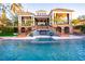 Stunning backyard with a luxurious pool, a raised spa, and beautiful brick stairs leading to the home at 1541 Bay Point Dr, Sarasota, FL 34236