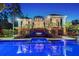 Luxury home backyard featuring a swimming pool, jacuzzi, and outdoor entertainment area under the covered patio at 1541 Bay Point Dr, Sarasota, FL 34236